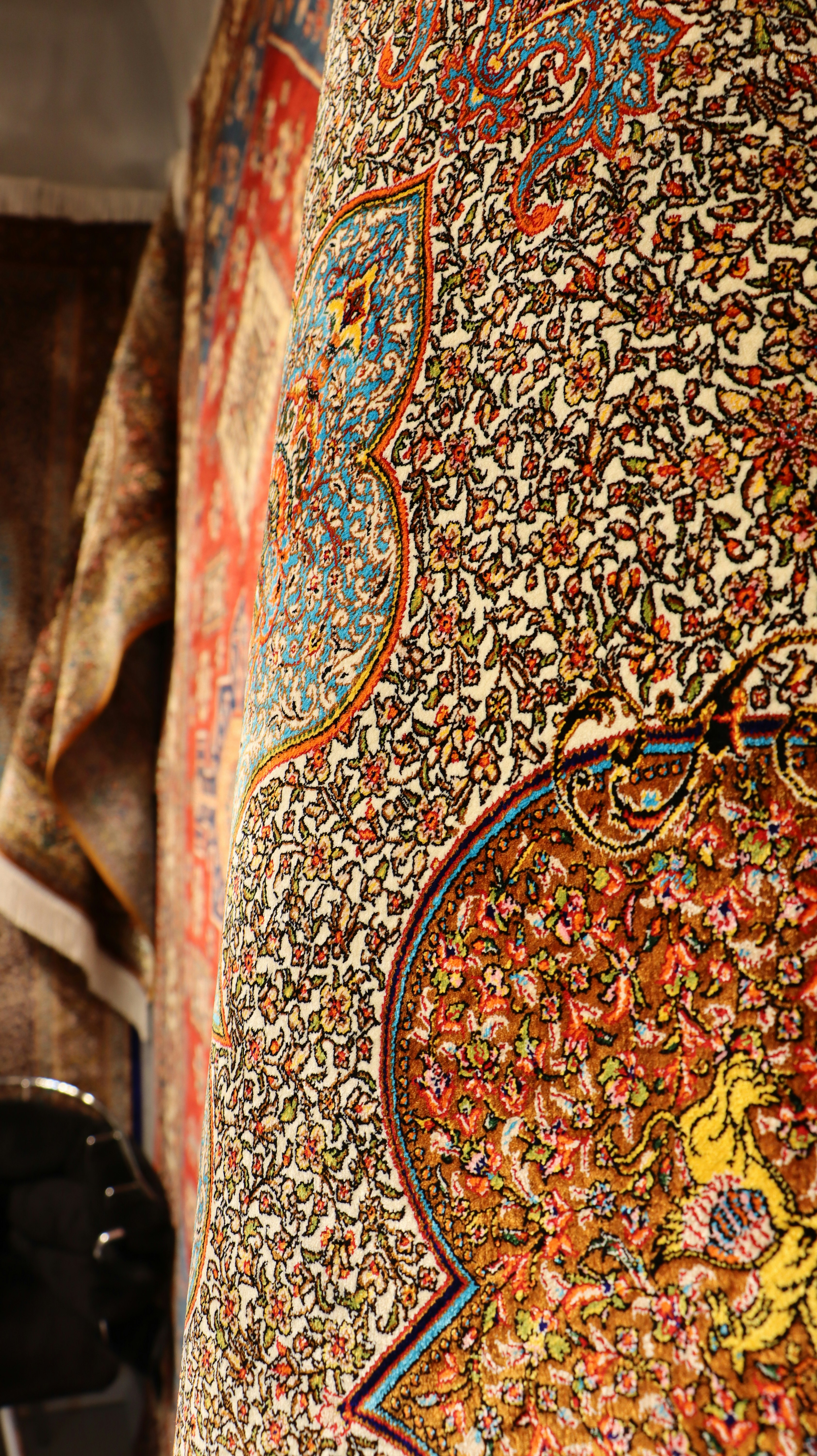 A close up of a person's hand holding a cell phone