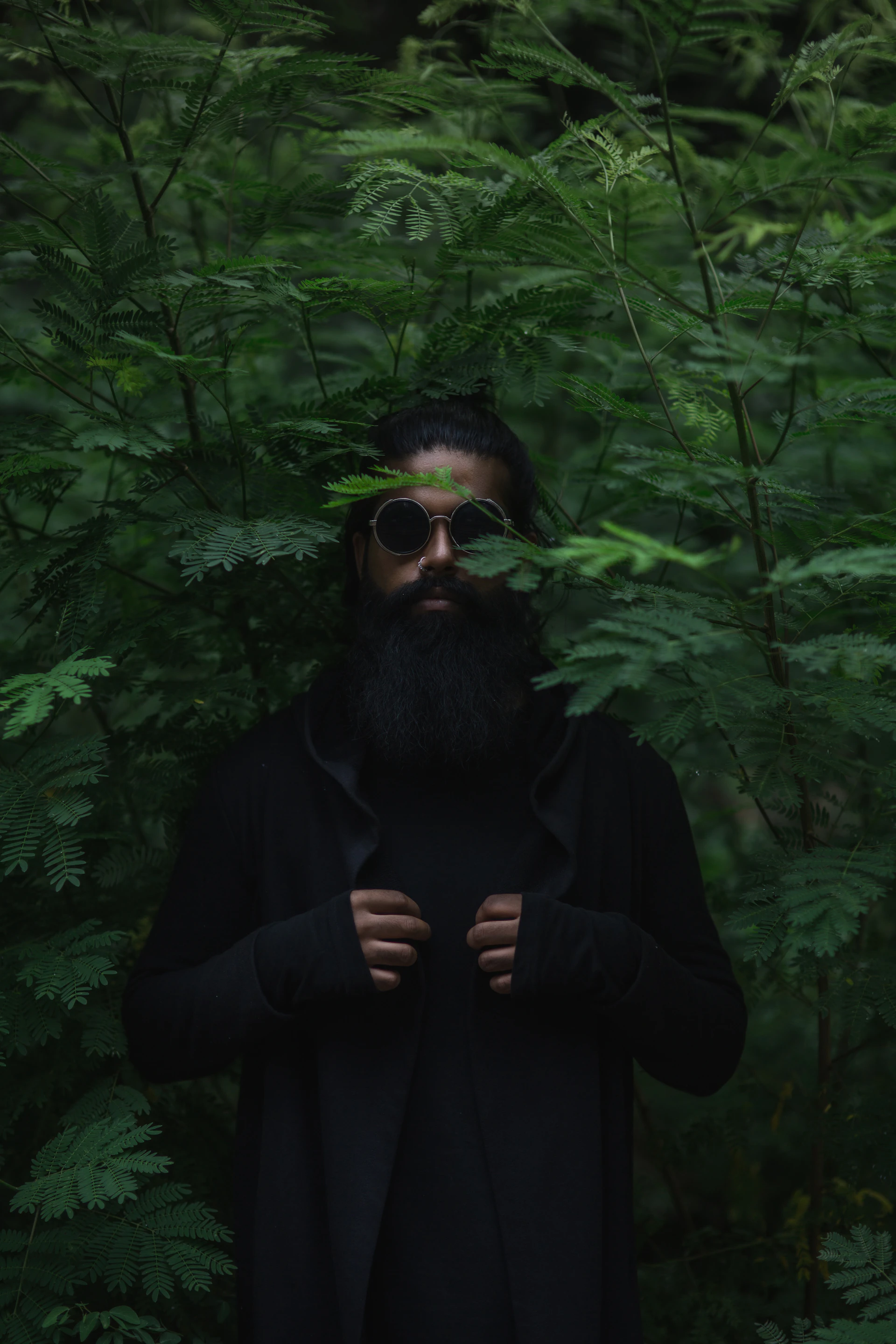 Man standing in a forest, portrait session