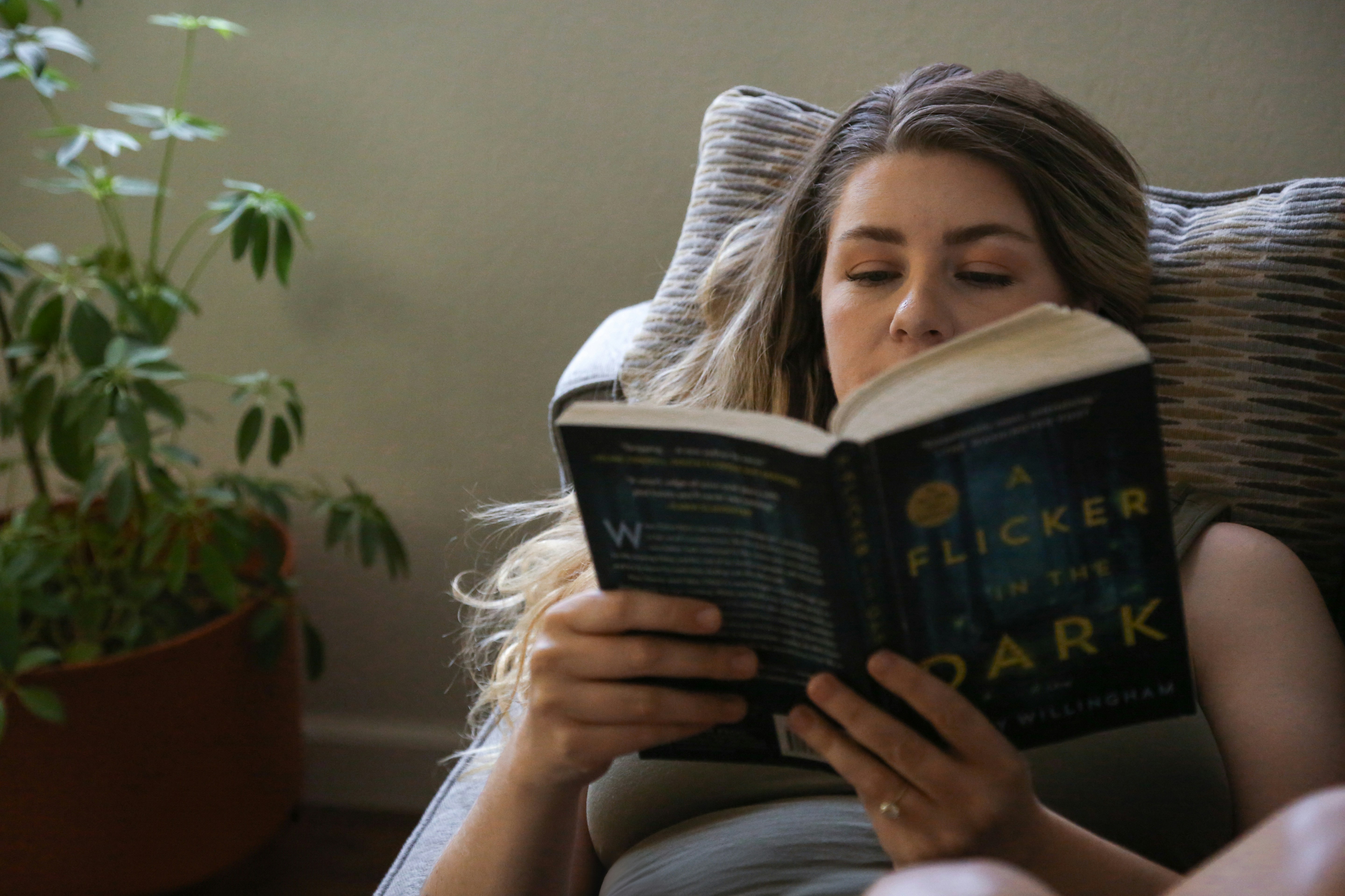 Mother reading on couch