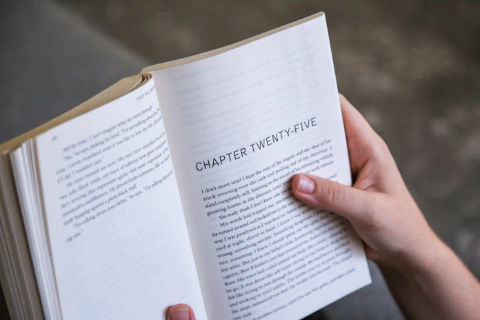 A person holding a book in their hands
