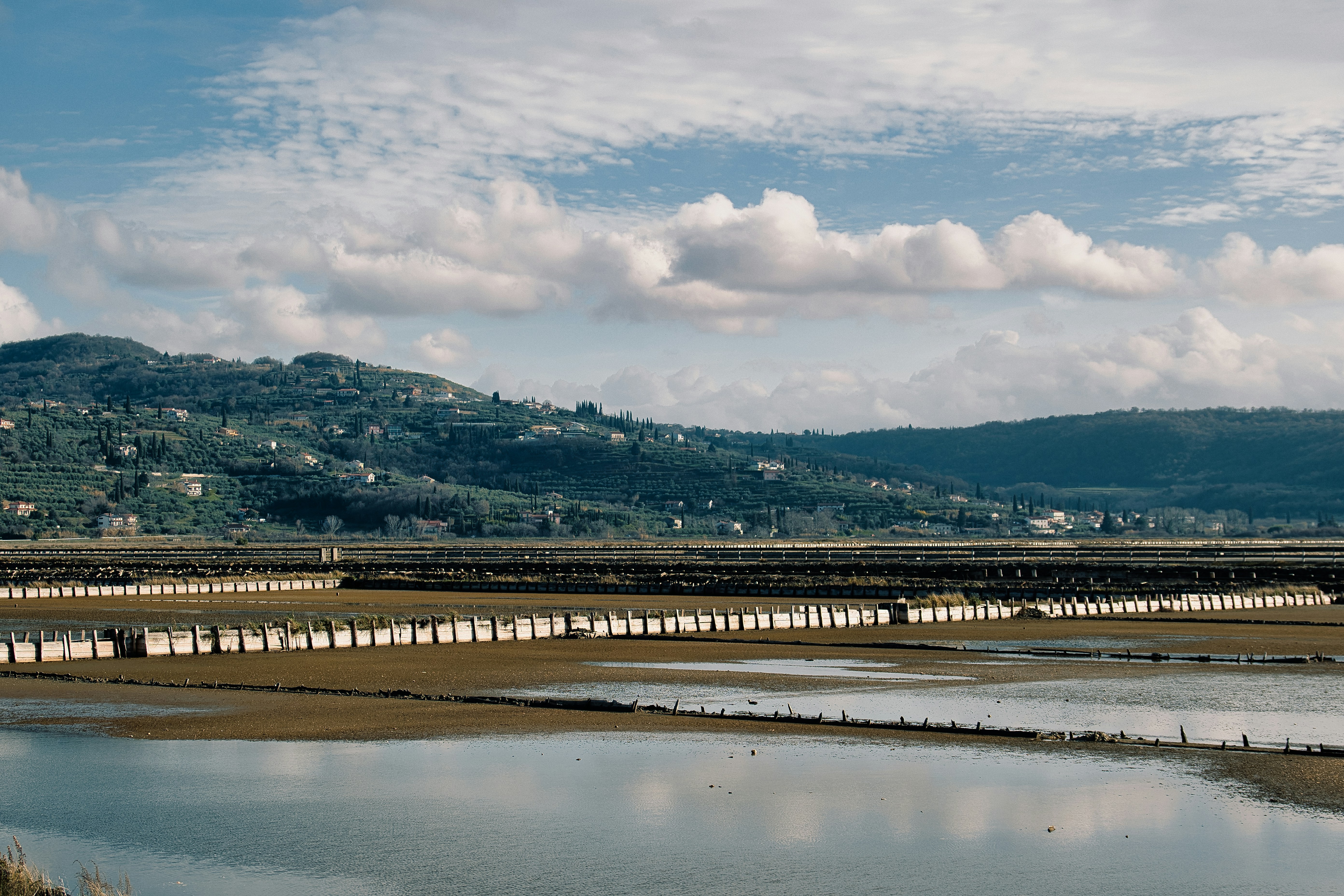 A large body of water with a mountain in the background