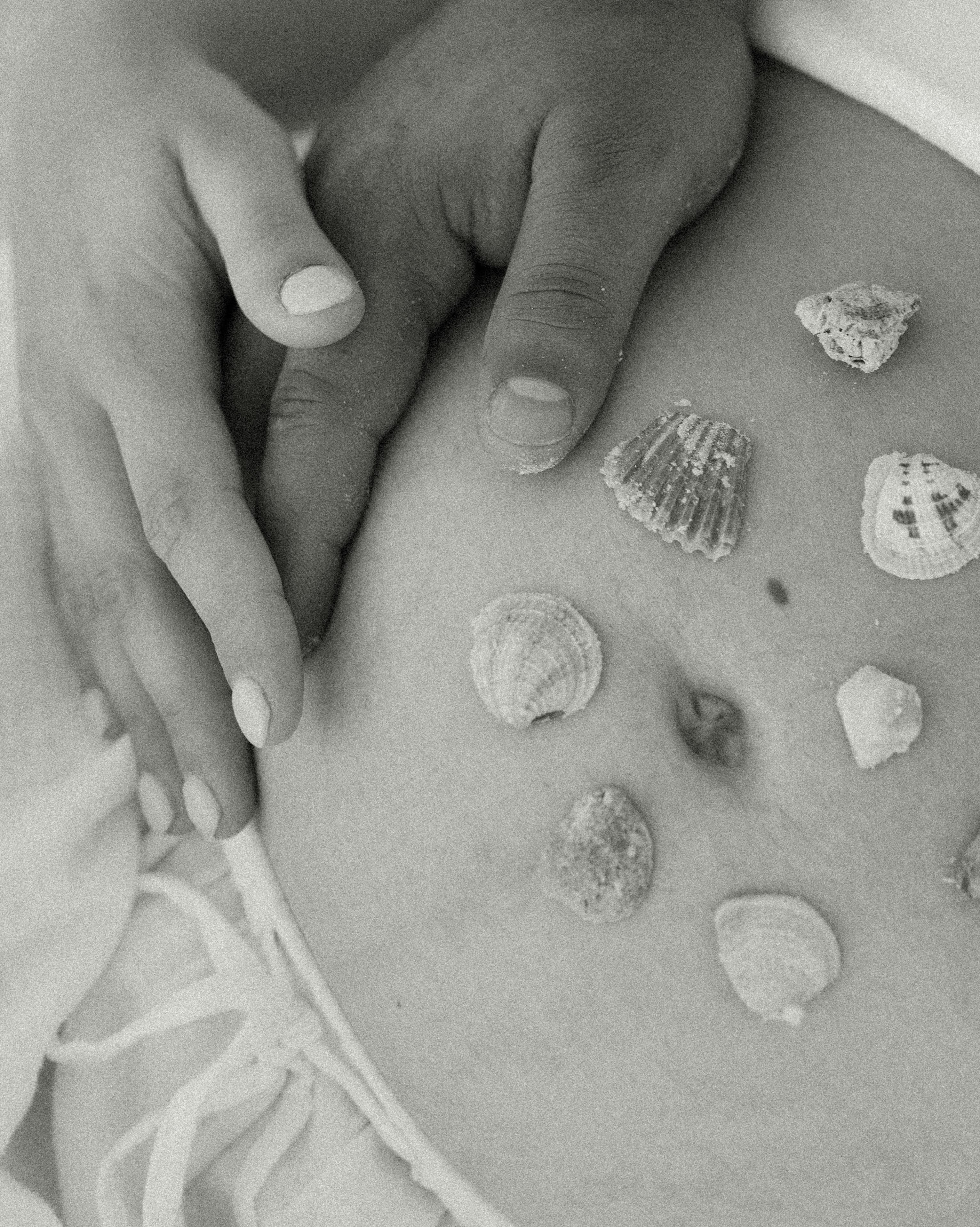 A black and white photo of a pregnant belly