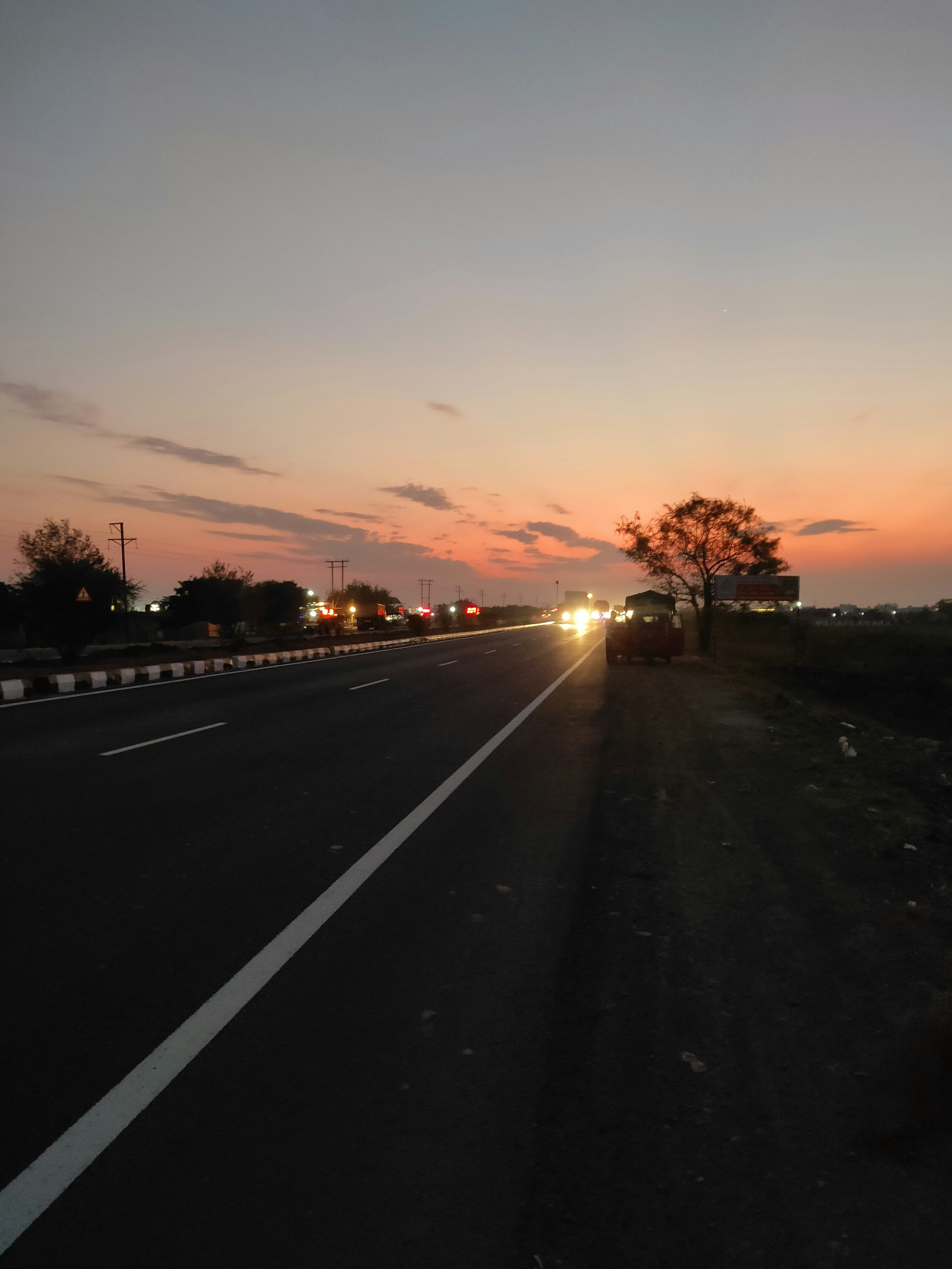 Highway at dusk, long road, atmospheric low-light scene