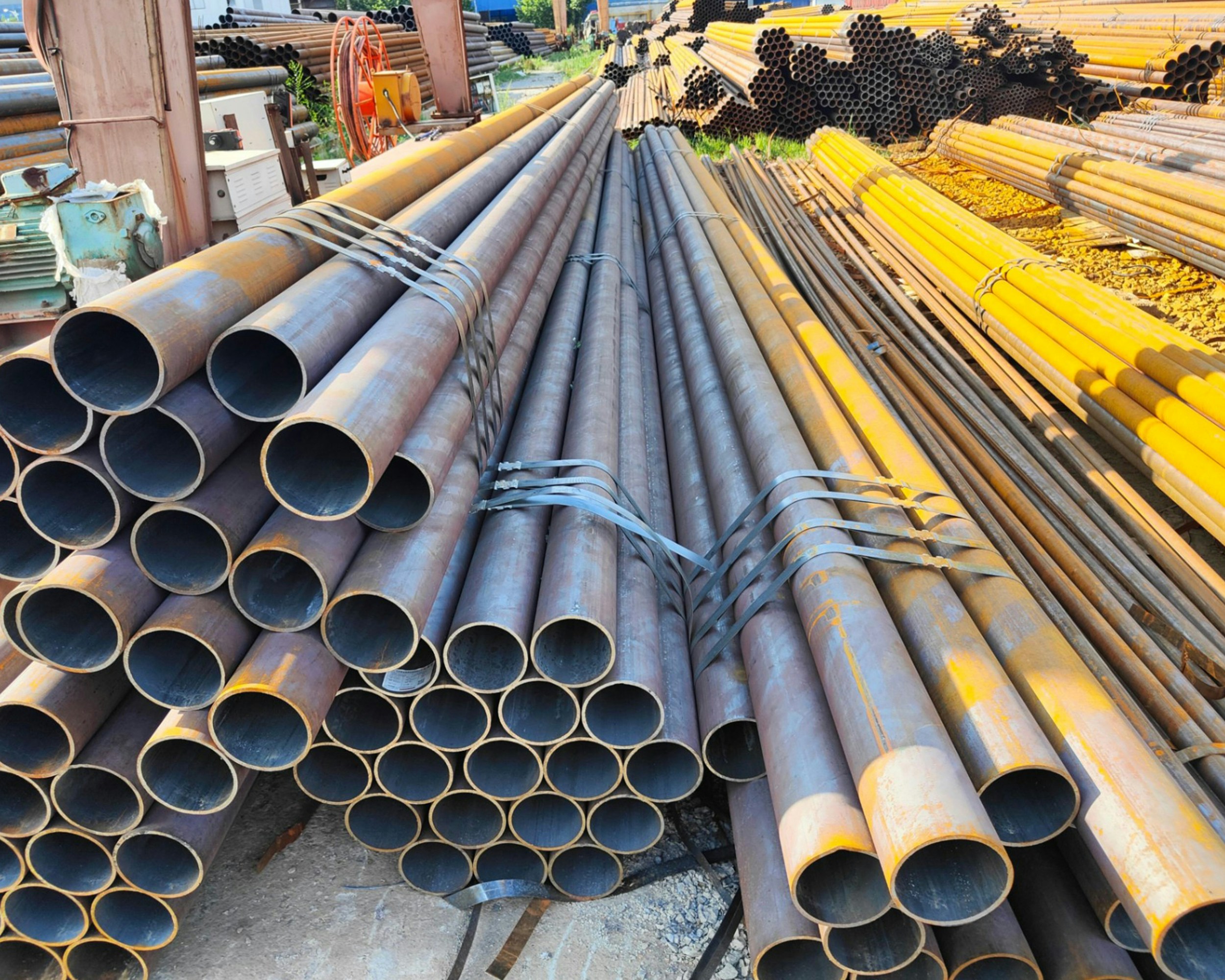 Galvanized iron pipes with shiny zinc-coated surface in a storage facility