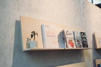 A row of books sitting on top of a shelf