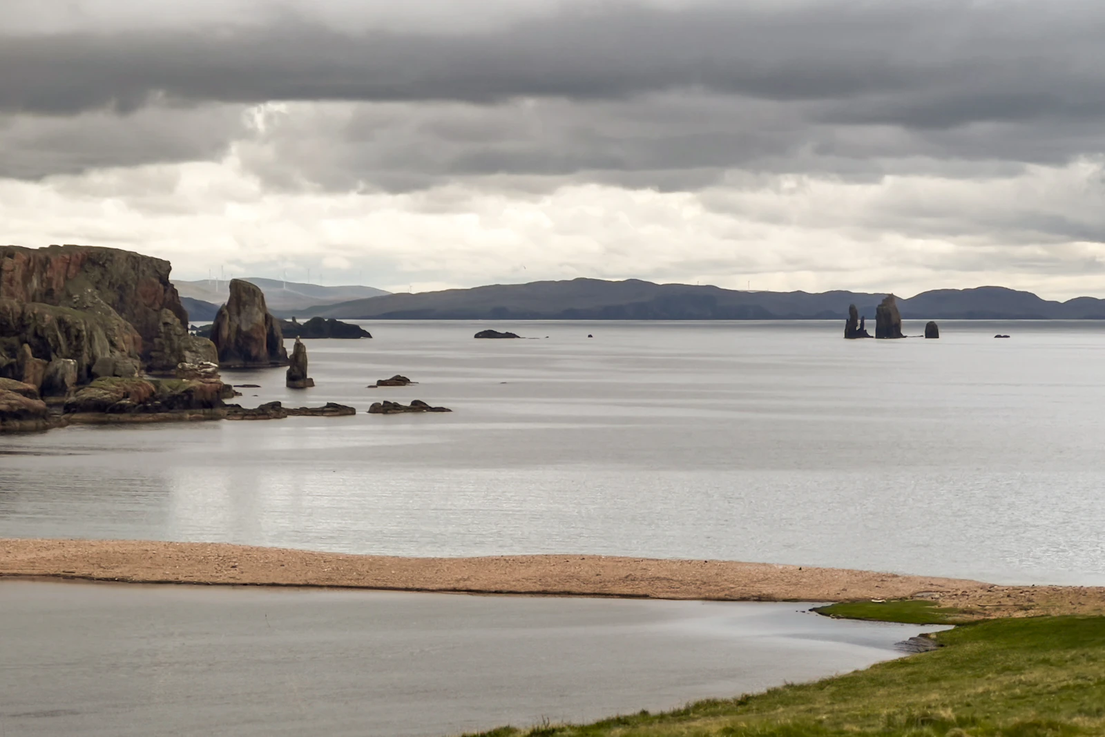 Sea stacks off the coast at Braewick under a grey sky — Shetland, United Kingdom