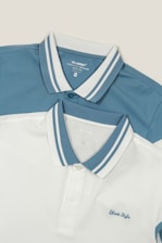 Two white and blue polo shirts on a white background