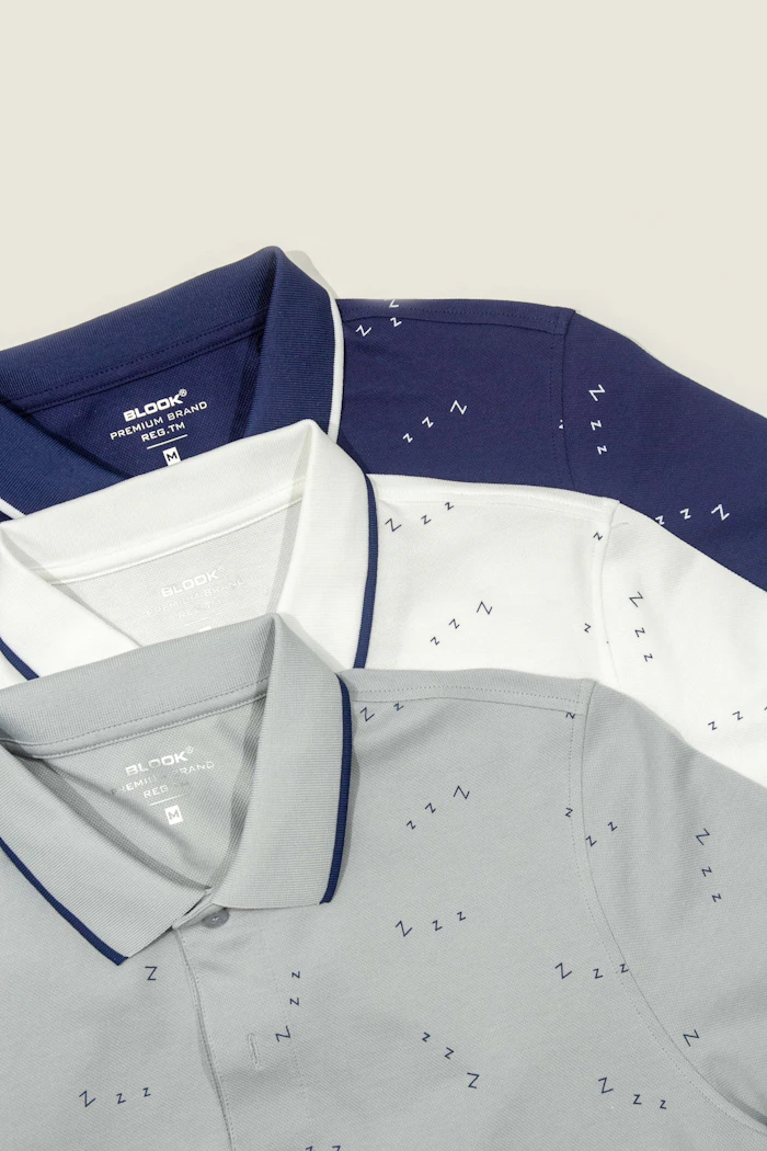 Three men's polo shirts on a white background