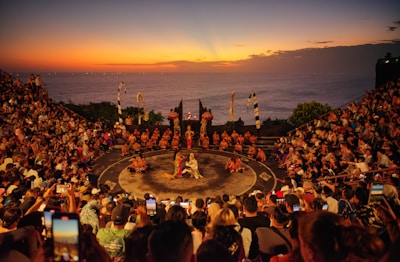 A crowd of people watching a show on a stage