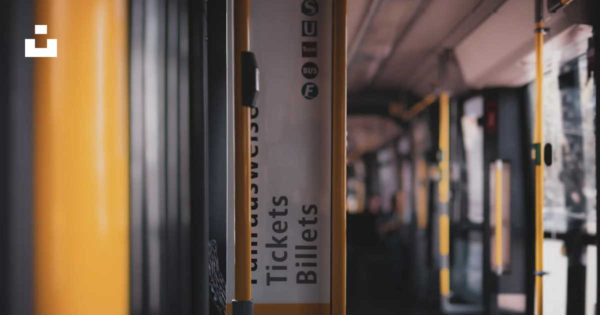 Standee Sign Bus A sign hanging from the side of a bus photo – Free Grey Image on Unsplash