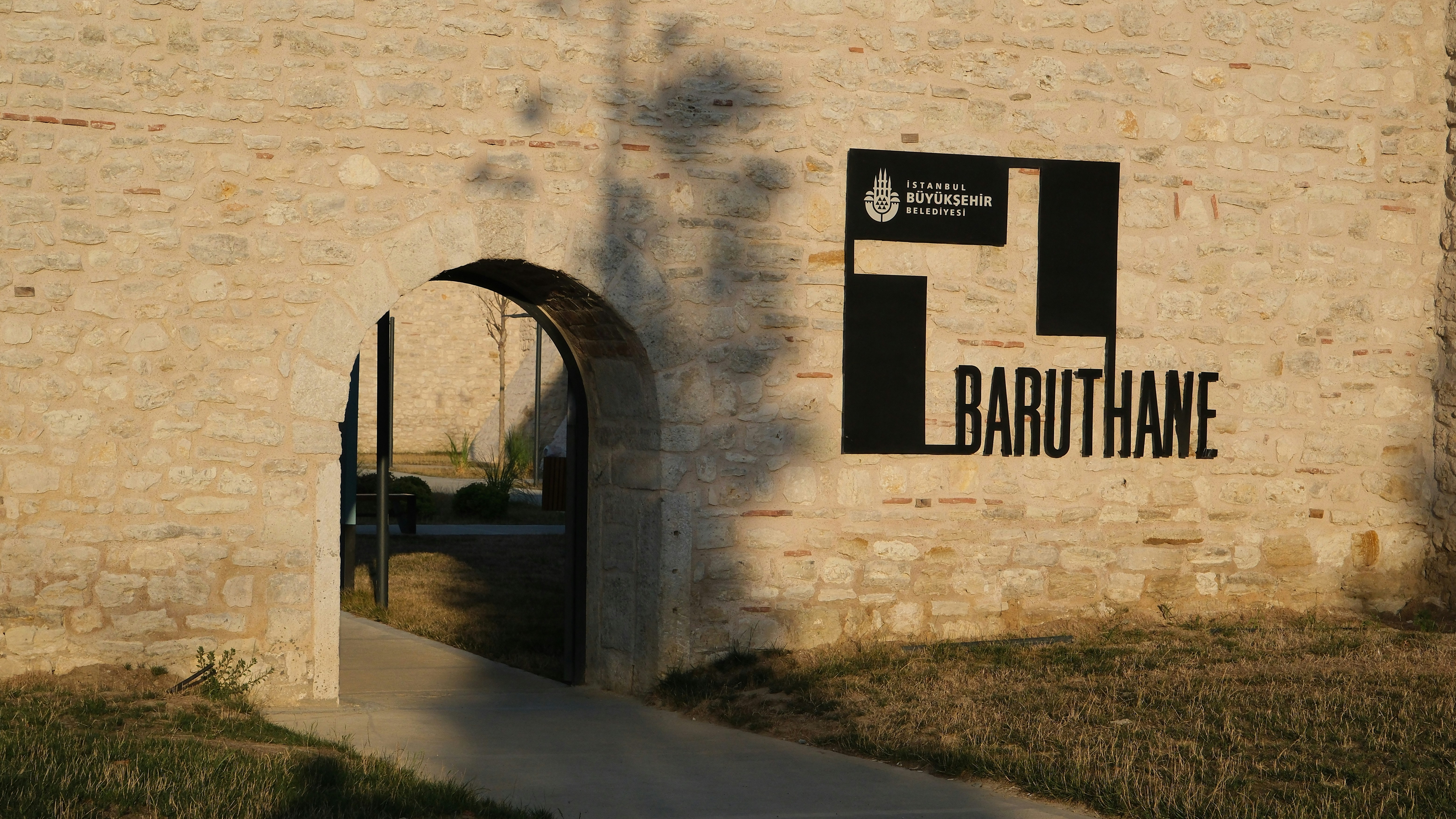 A brick building with a sign on it