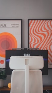 A white speaker sitting on top of a wooden table