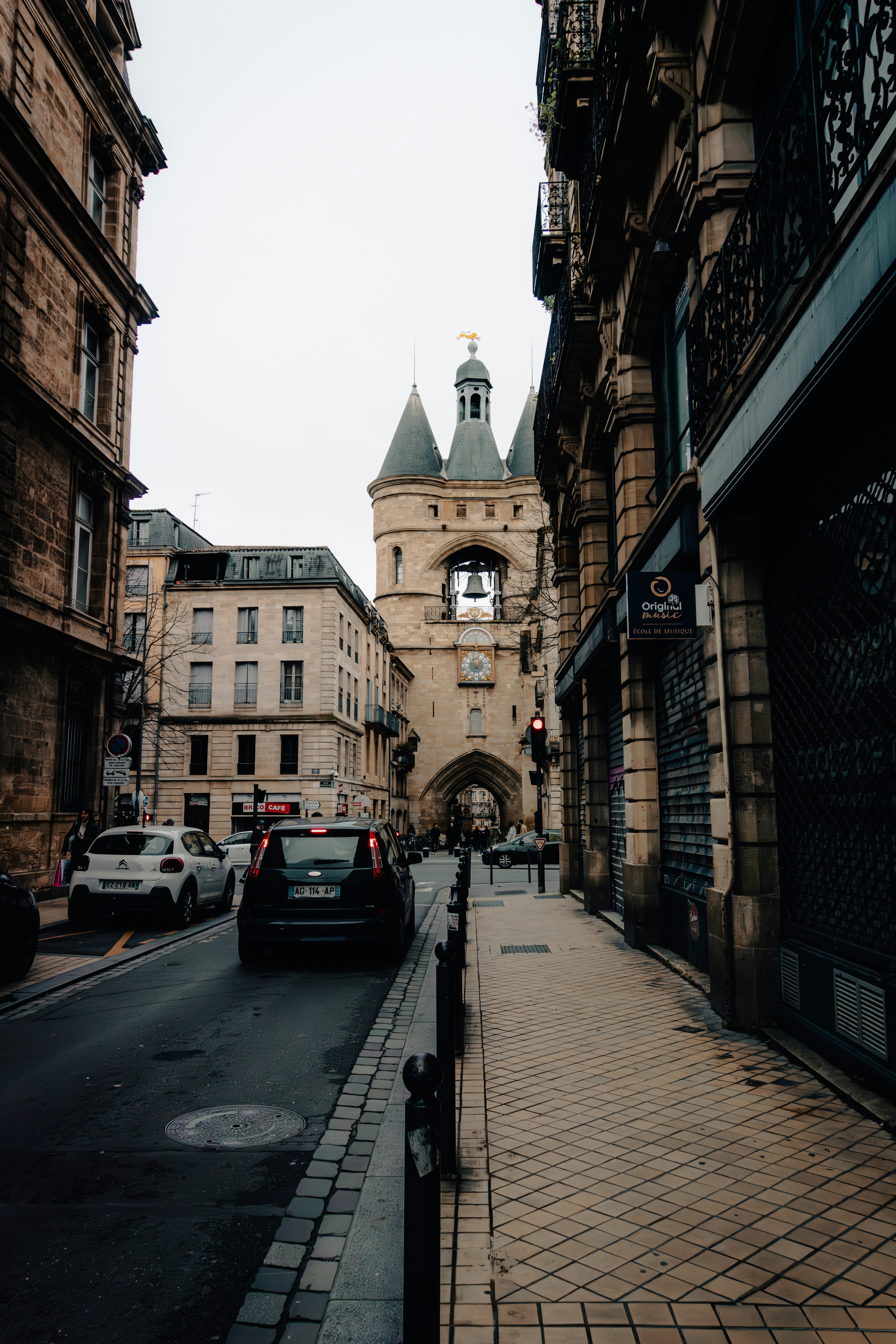 A city street with a clock tower in the background