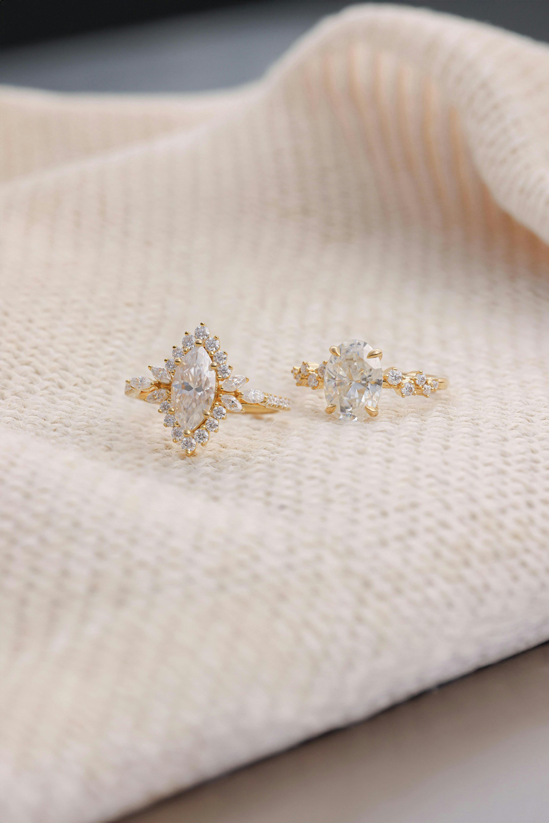 A pair of earrings sitting on top of a white cloth