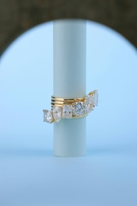 A gold ring with three diamonds on it