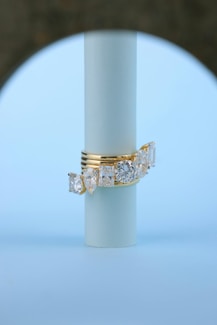 A gold ring with three diamonds on it