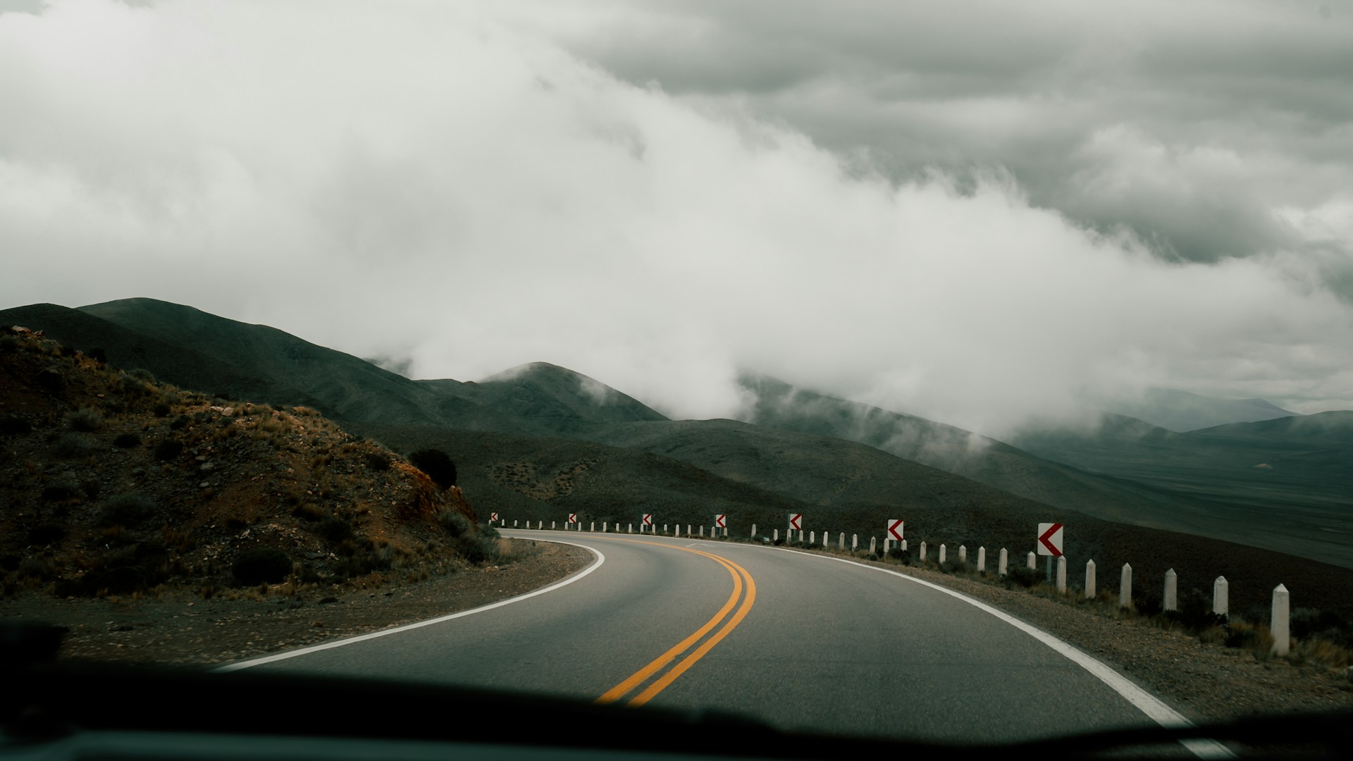 A view from inside a car of a mountain road
