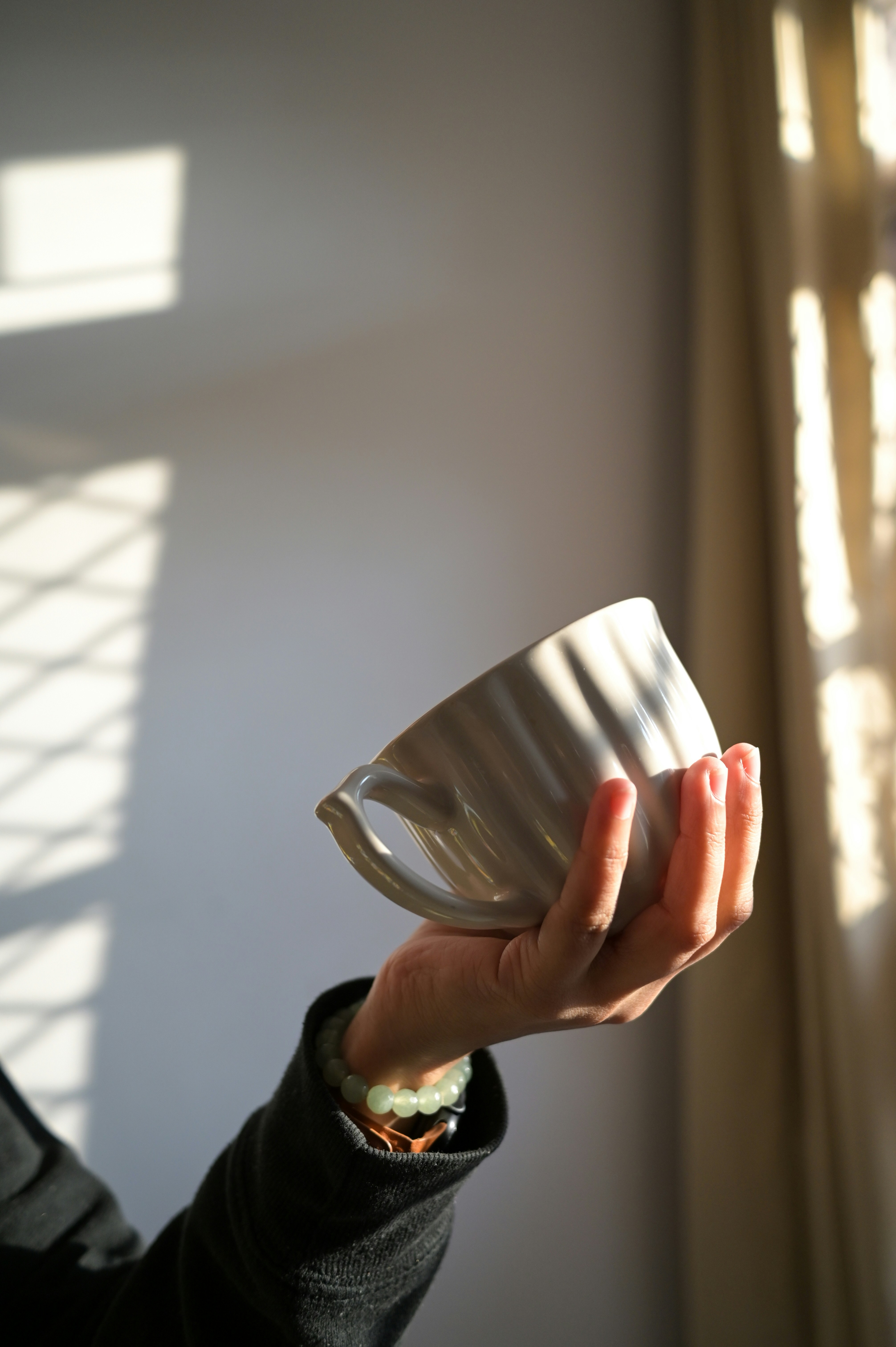 A person holding a cup in their hand
