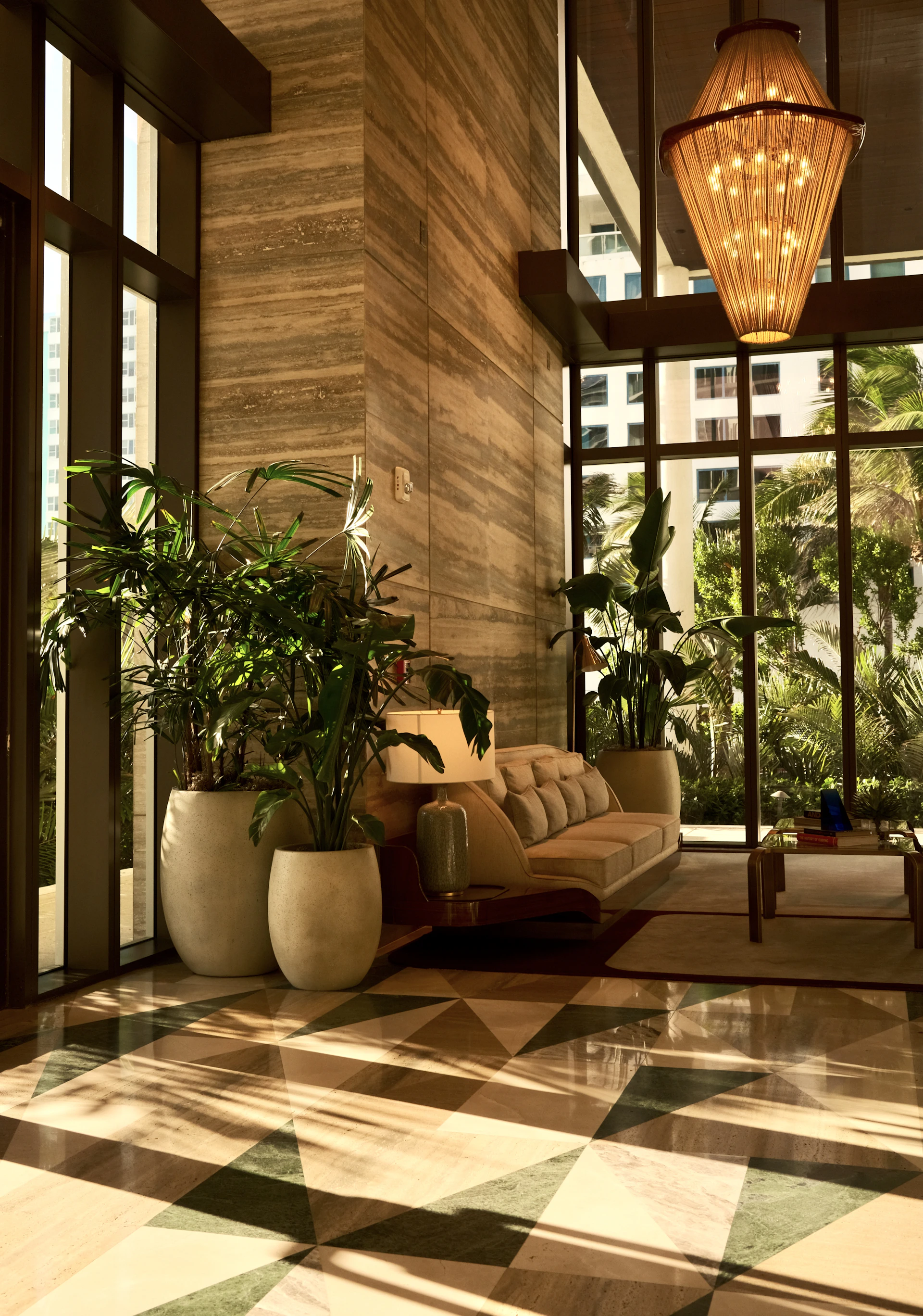 A living room with a checkered floor and large windows