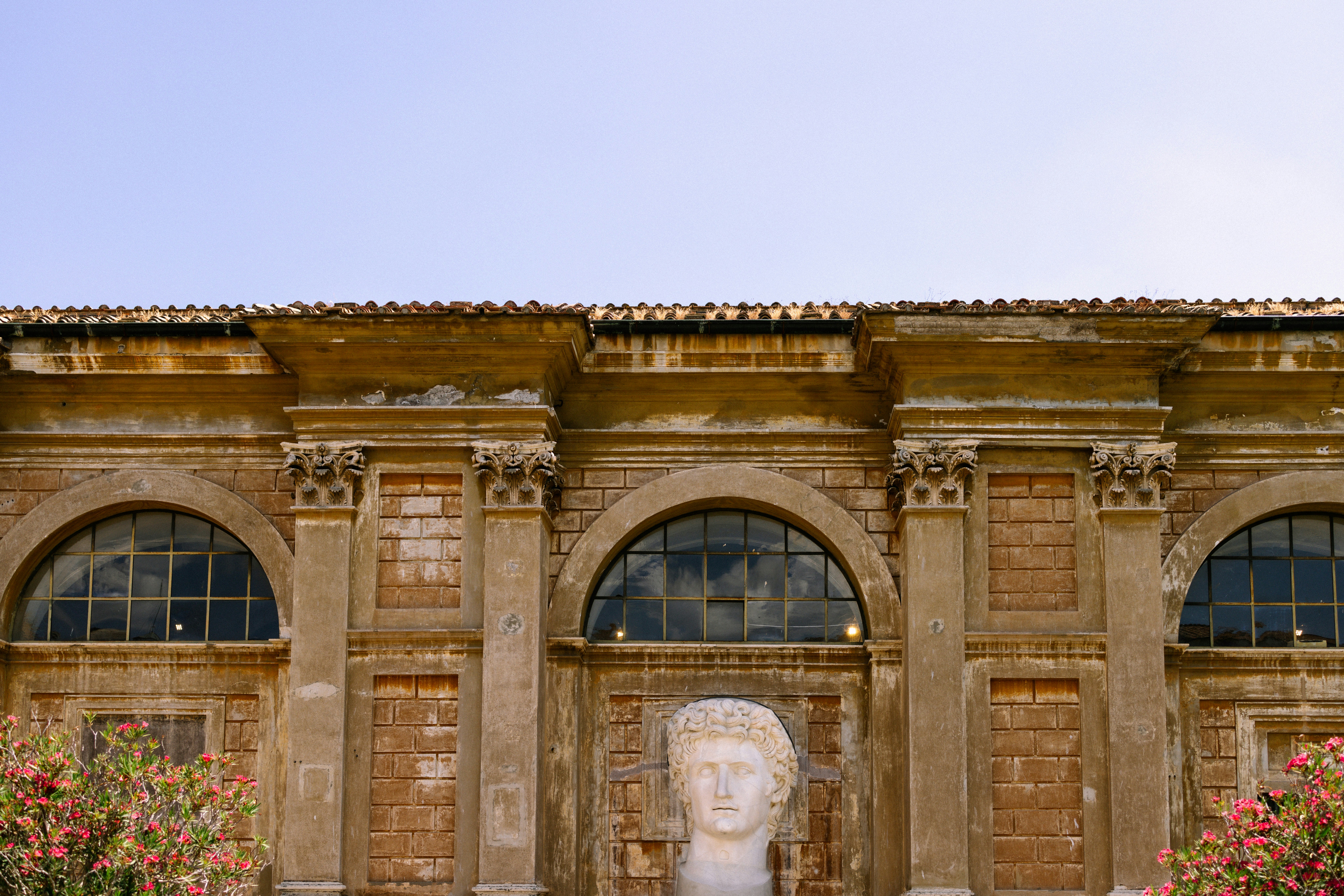 A large building with a statue in front of it