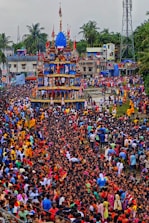 A large crowd of people standing in front of a building