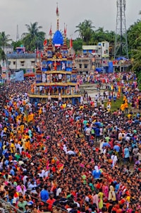 A large crowd of people standing in front of a building