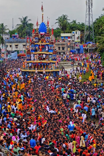 A large crowd of people standing in front of a building