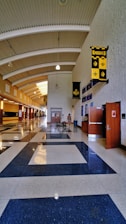 A long hallway with a blue and white checkered floor