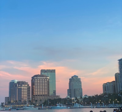 A body of water with a city in the background