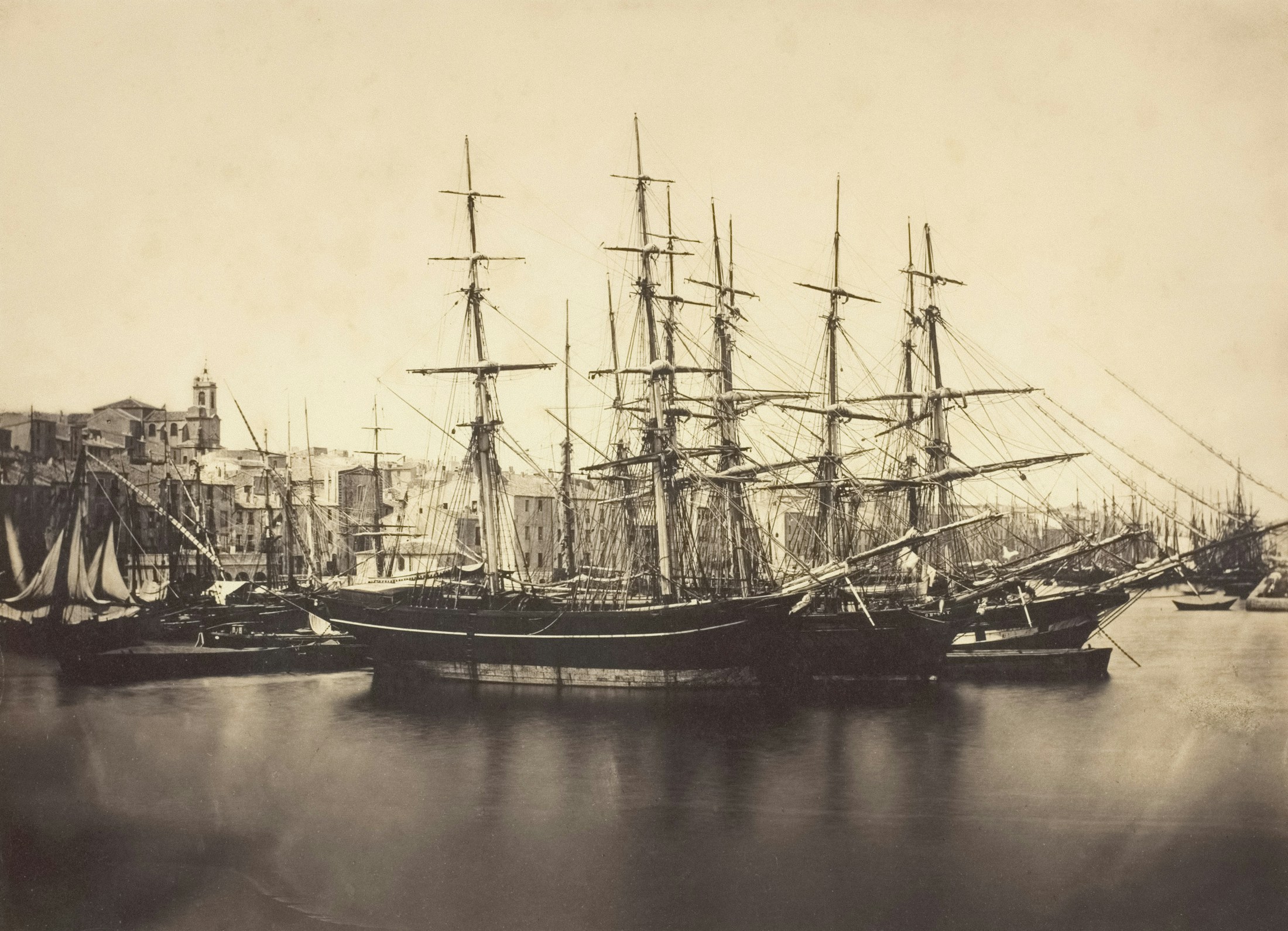 Sepia-toned harbour with tall masted ships — a reference image for the East India Company's trading fleet and the long arc of colonial rule in India.