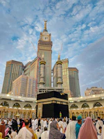A large group of people standing around a building