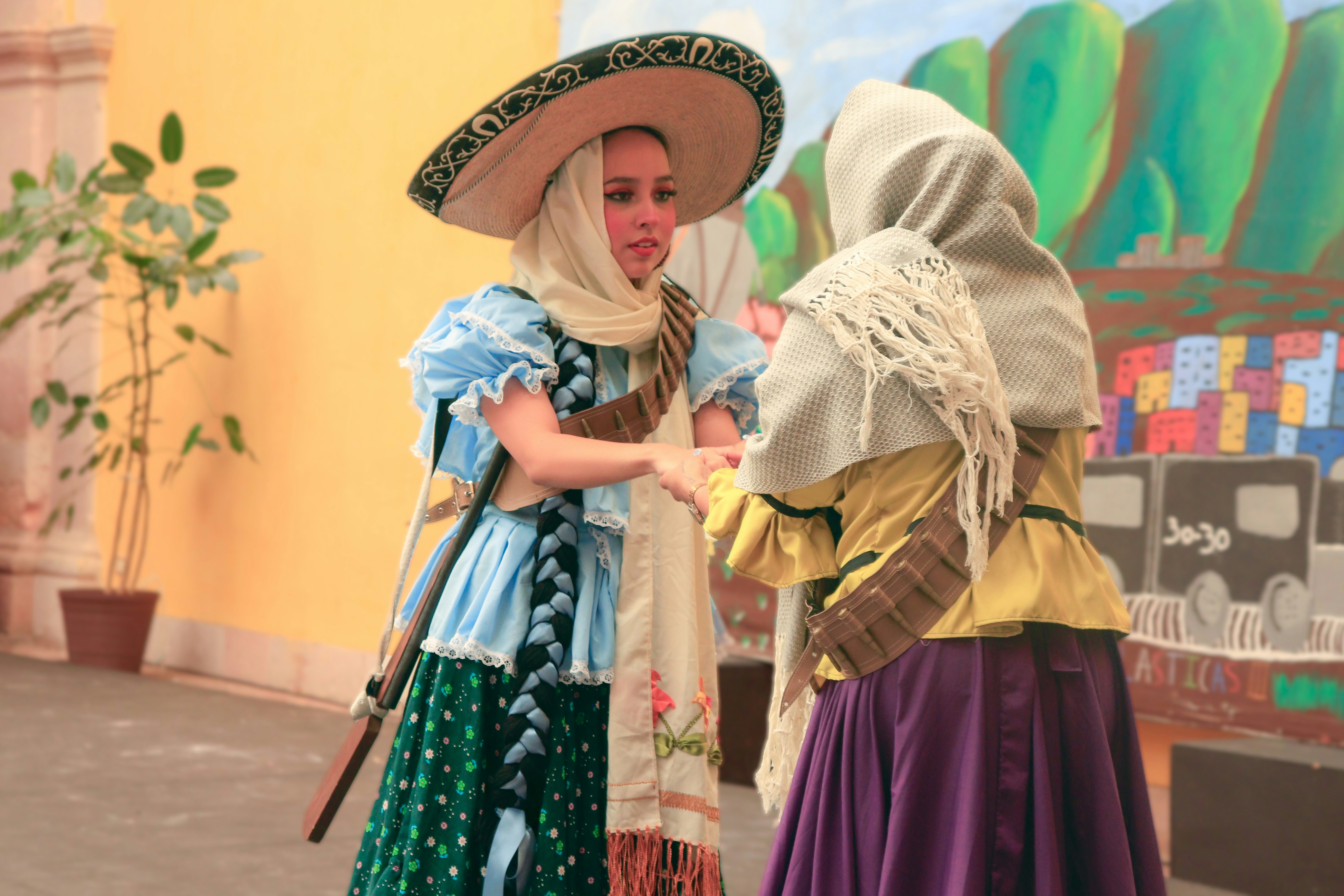 A couple of women standing next to each other