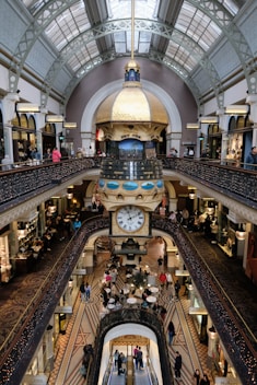 An overhead view of a shopping mall with a clock