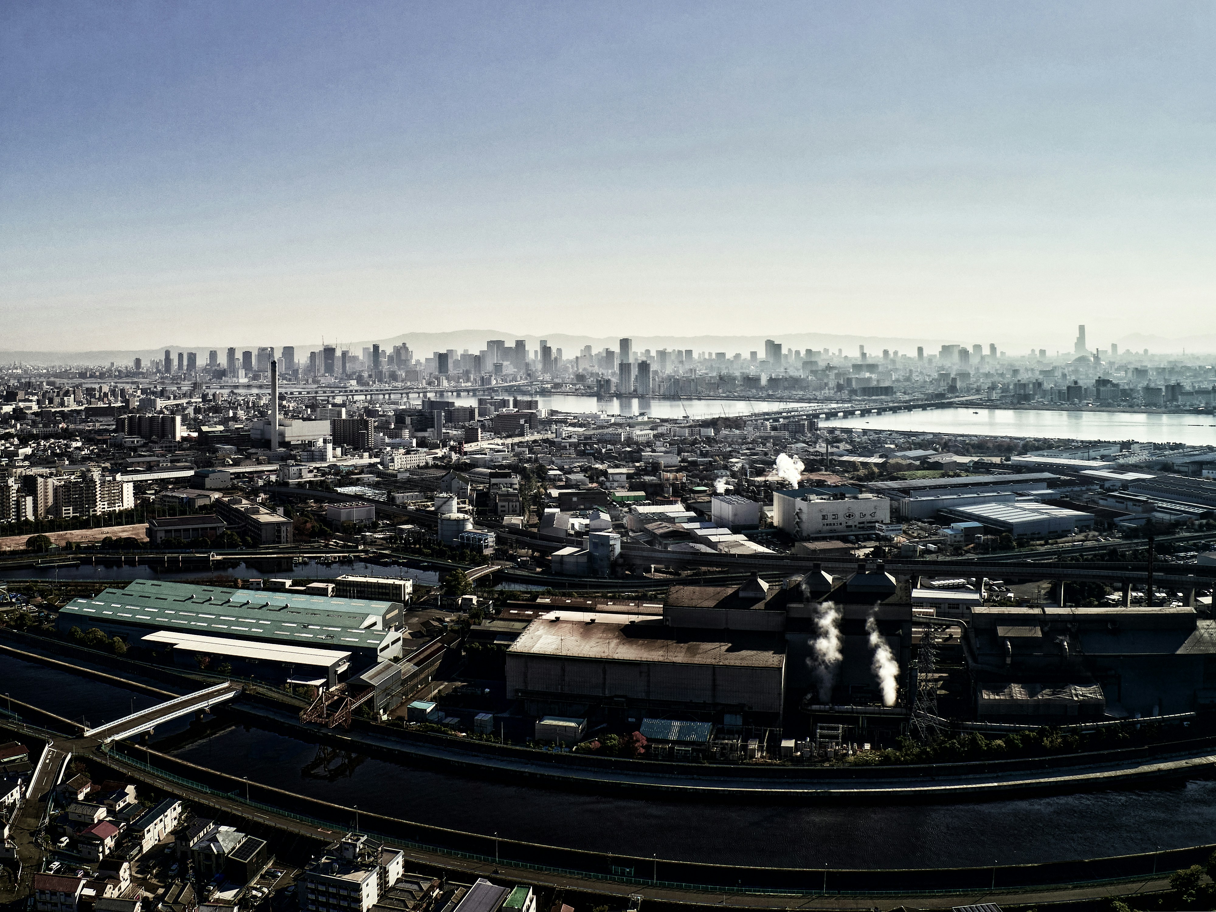 An aerial view of a city with a river running through it photo – Free ...