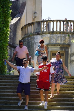A group of people walking down a set of stairs
