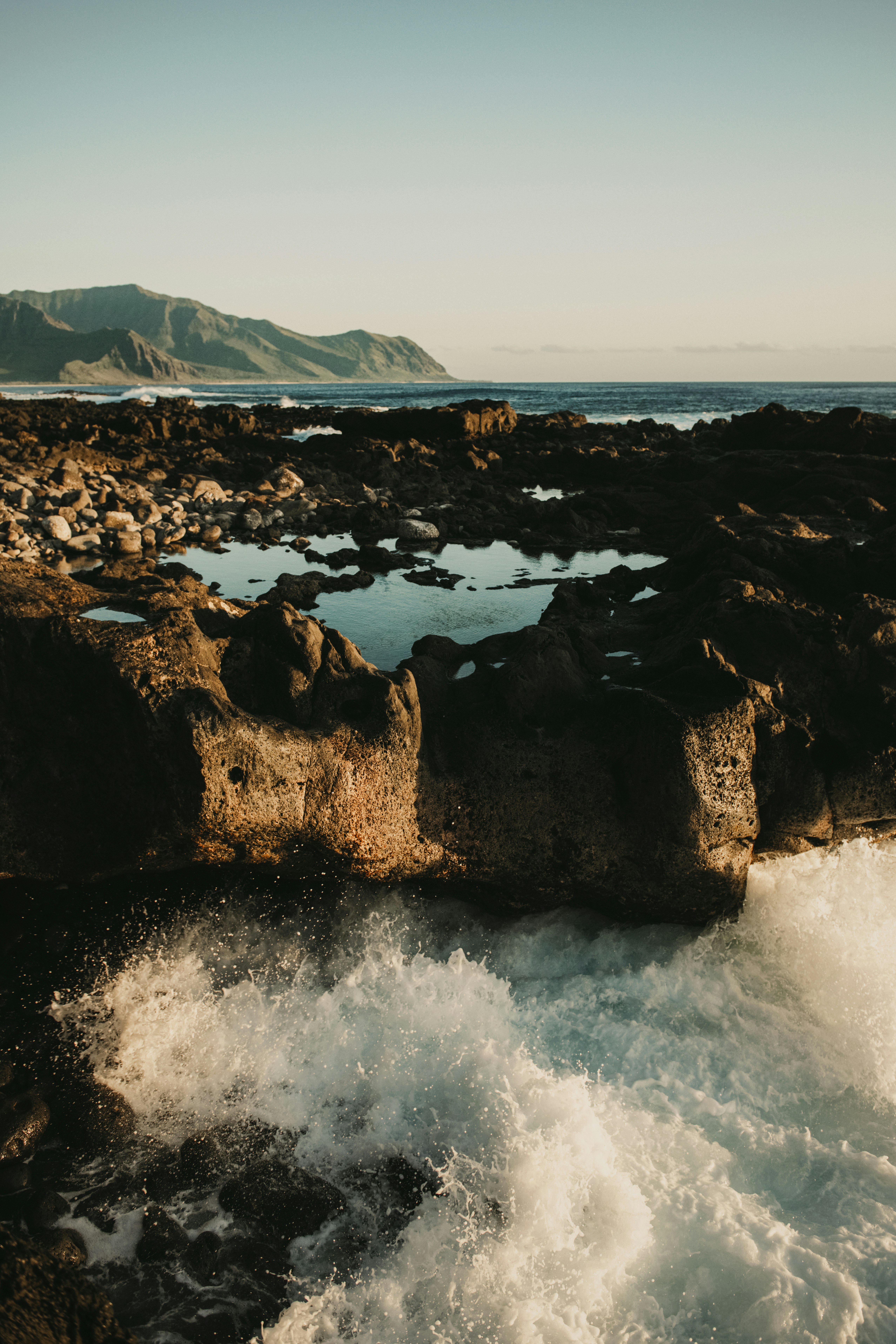 A body of water near a rocky shore