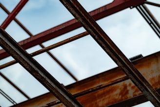 A close up of a metal structure with a sky background