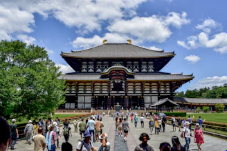 A large group of people standing in front of a building
