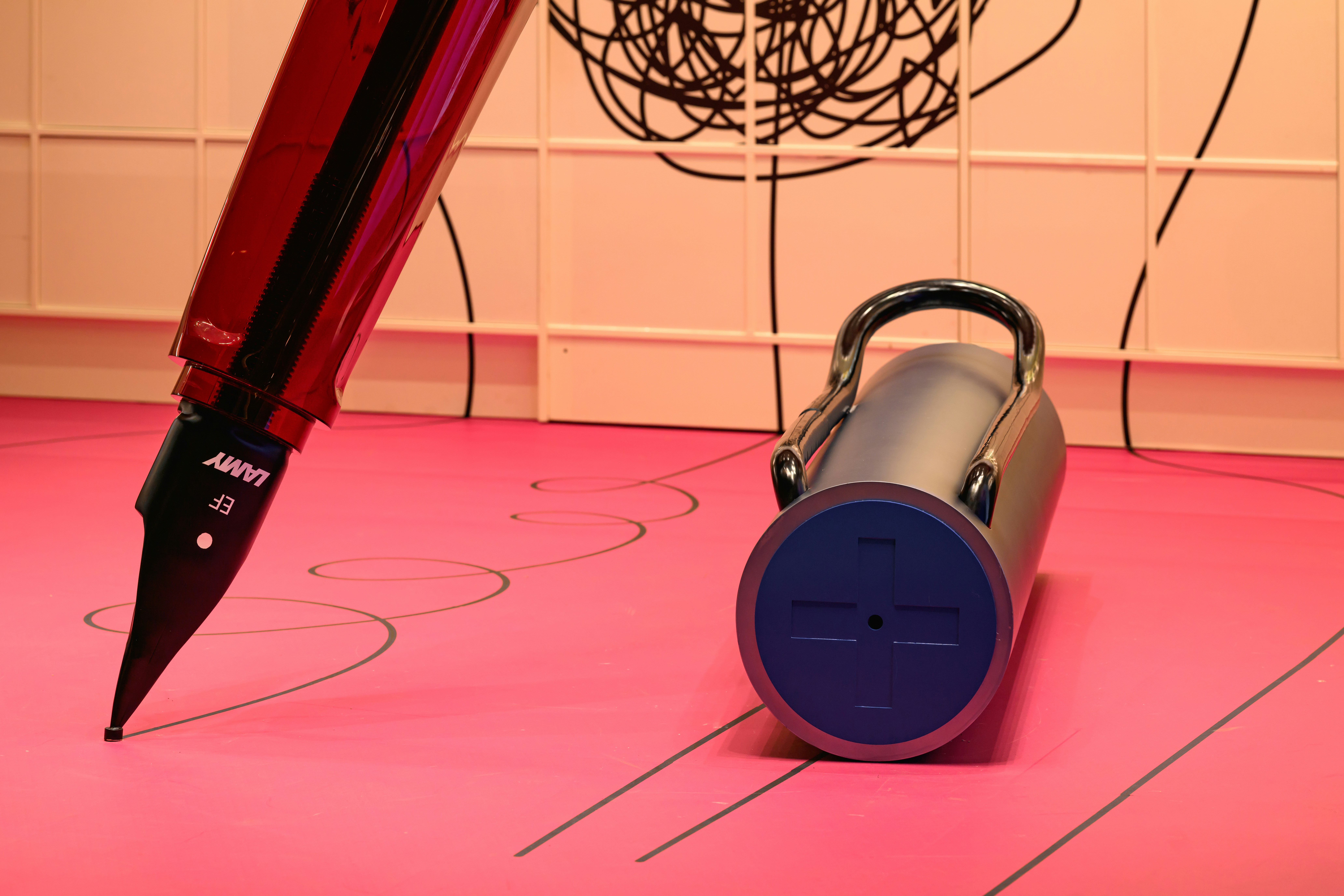 A pen sitting on top of a pink floor