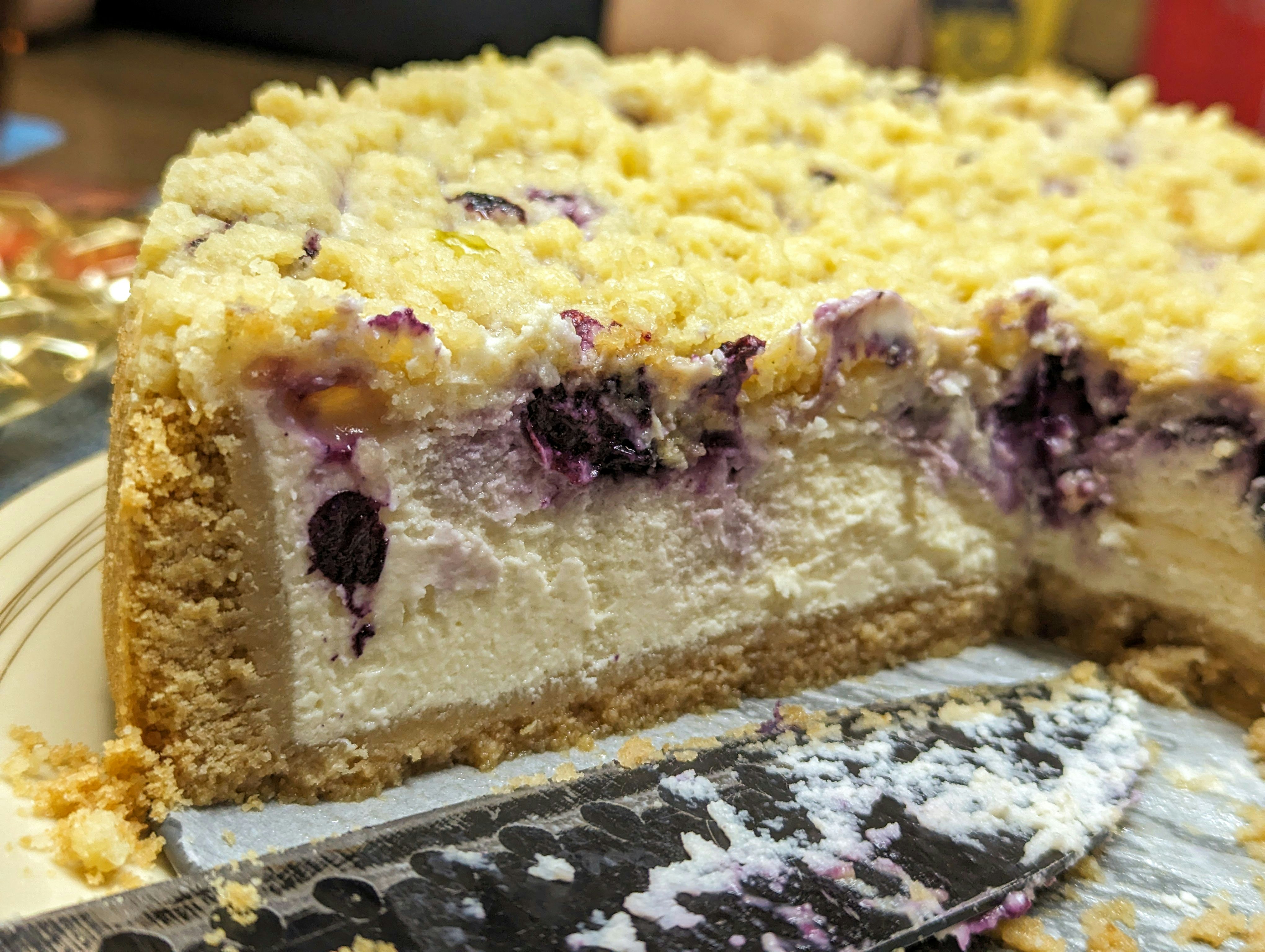 A close up of a cake on a plate with a knife
