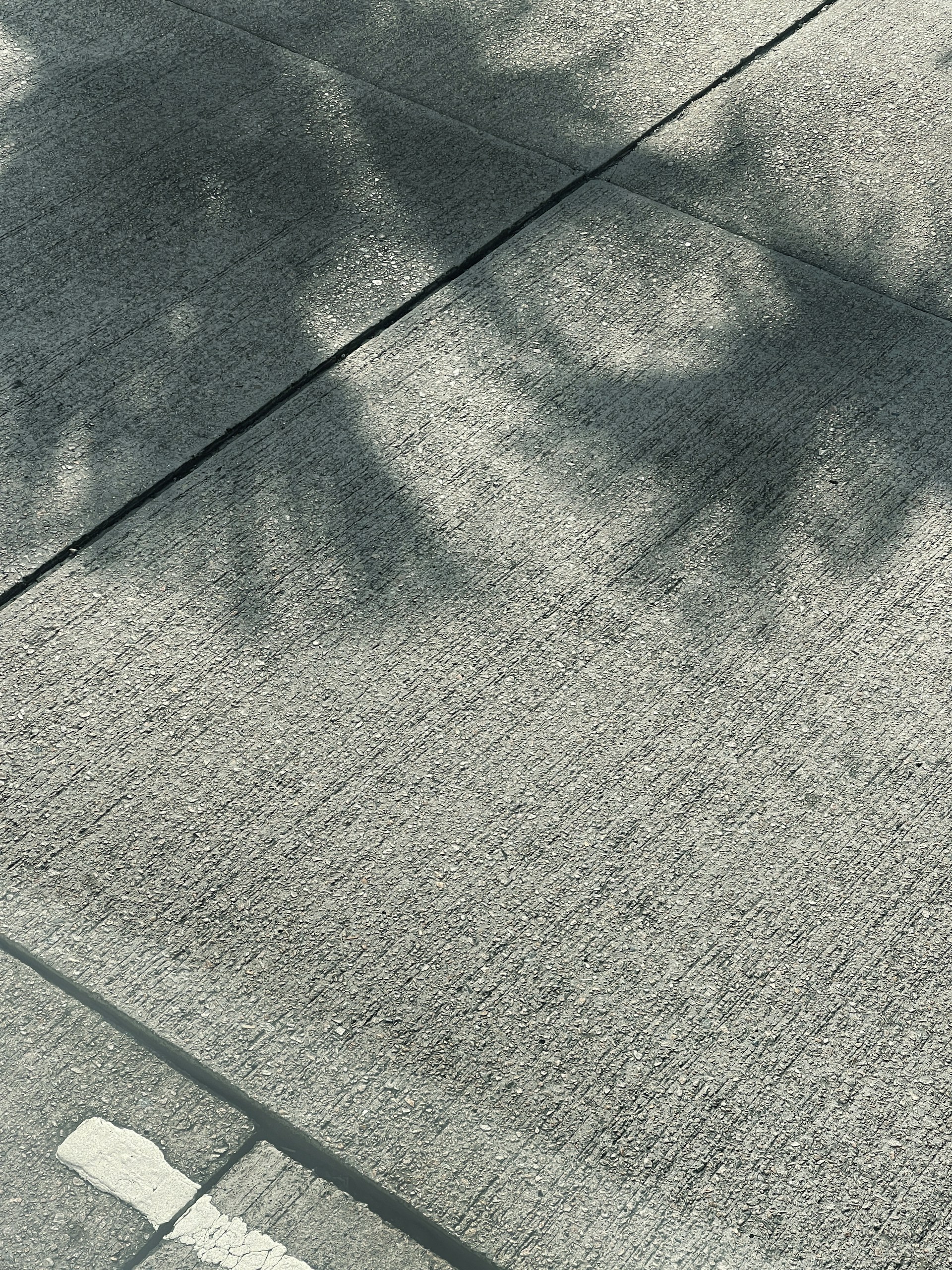A person riding a skateboard on a city street