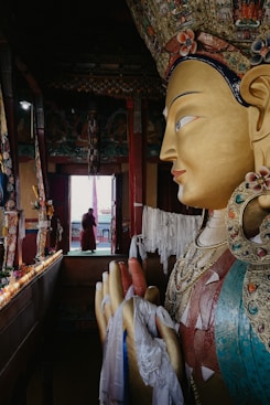 A statue of a buddha in a store