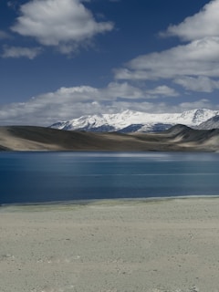 A large body of water surrounded by mountains