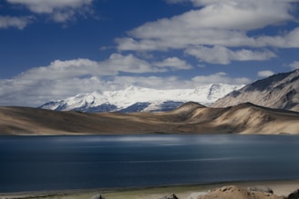 A large body of water surrounded by mountains