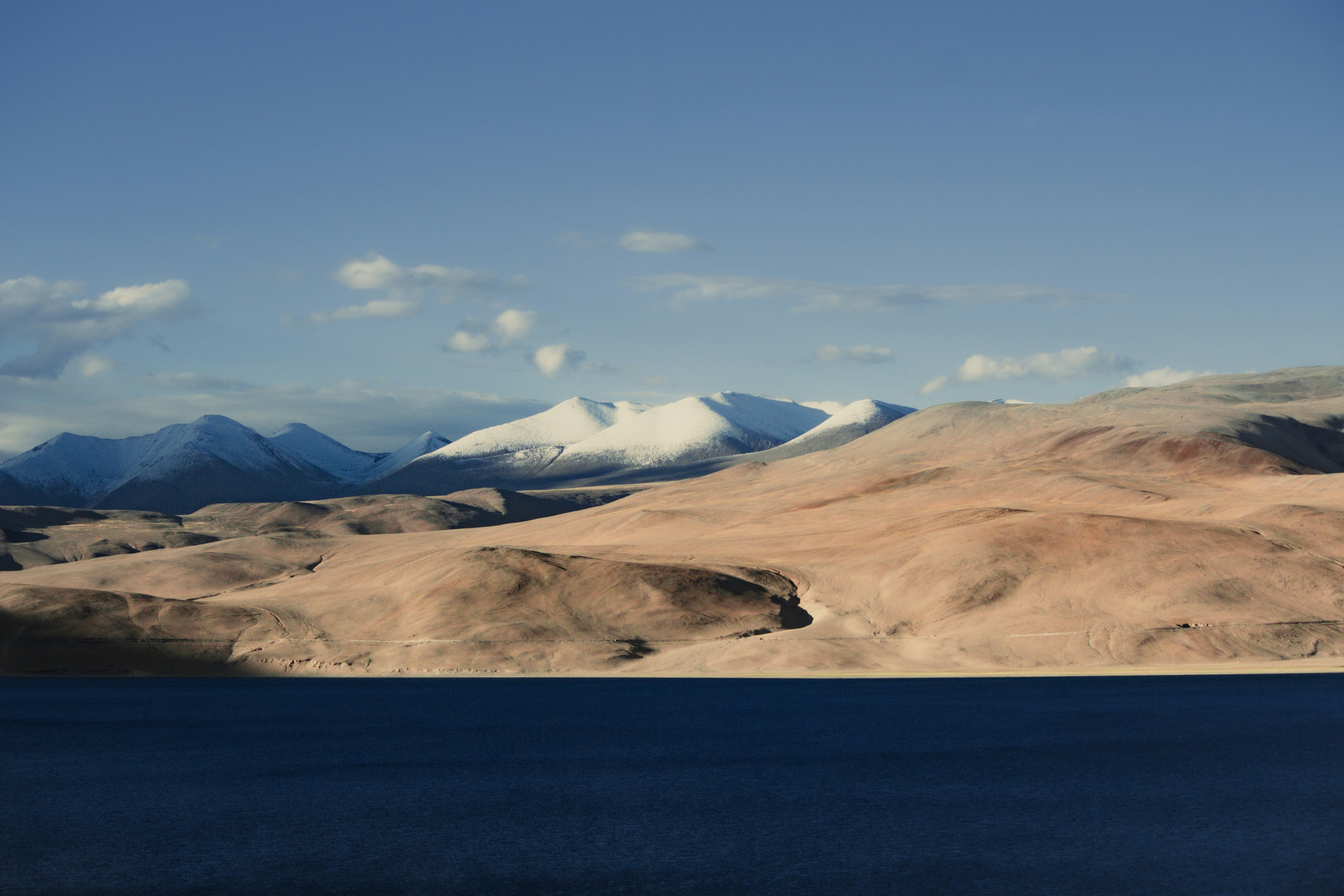 A large body of water surrounded by mountains