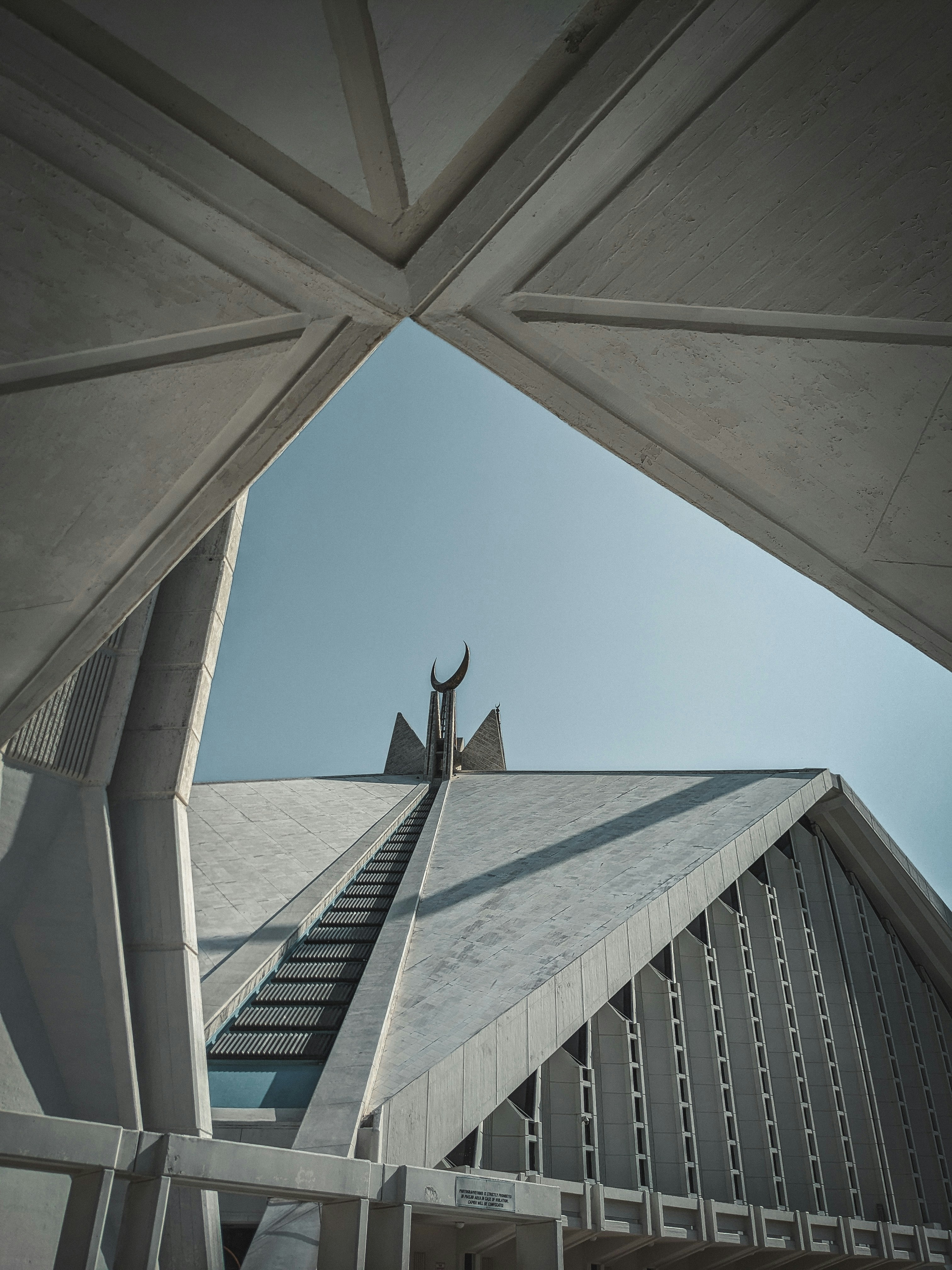 A building with a steeple and a sky background