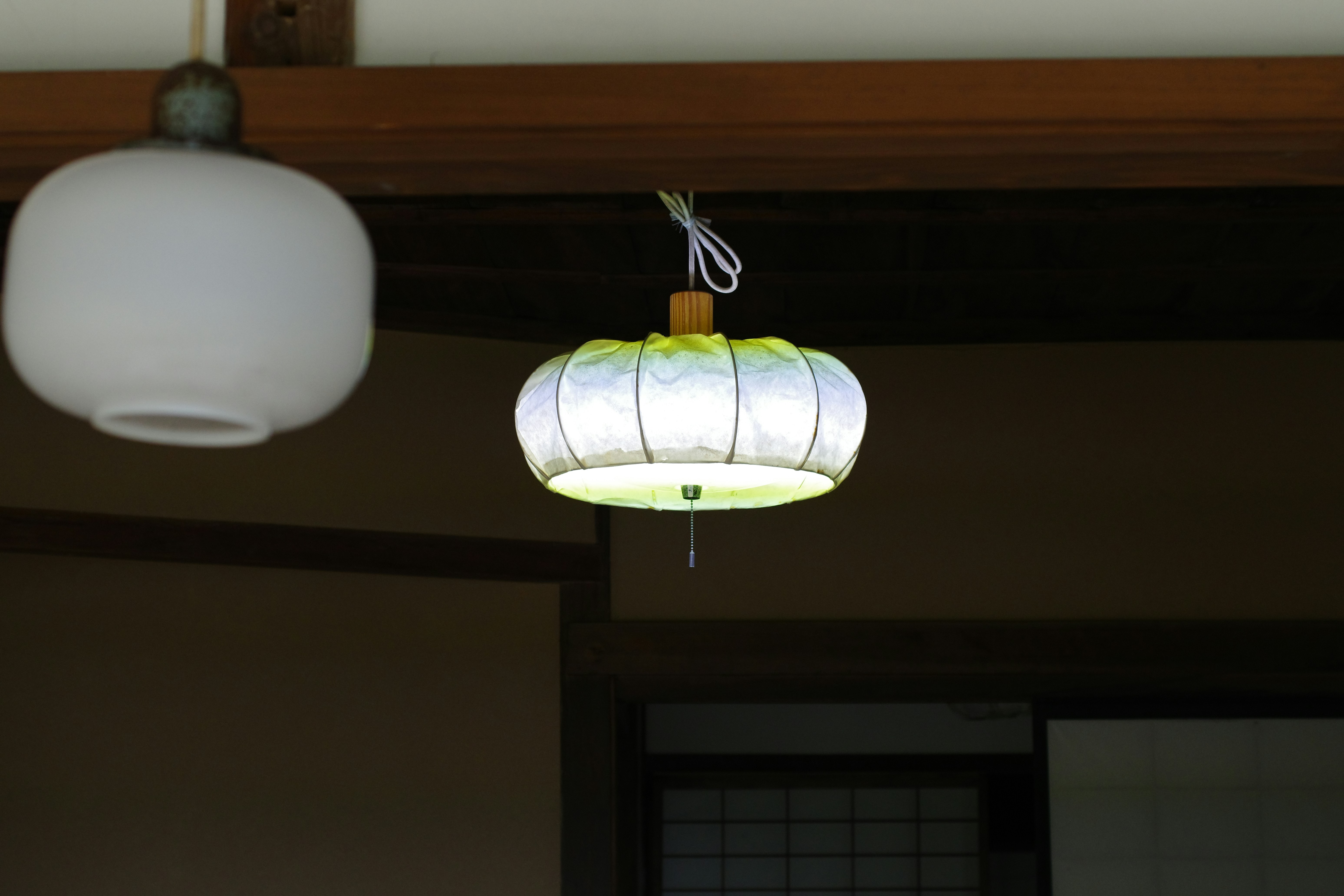 A couple of lights that are hanging from a ceiling