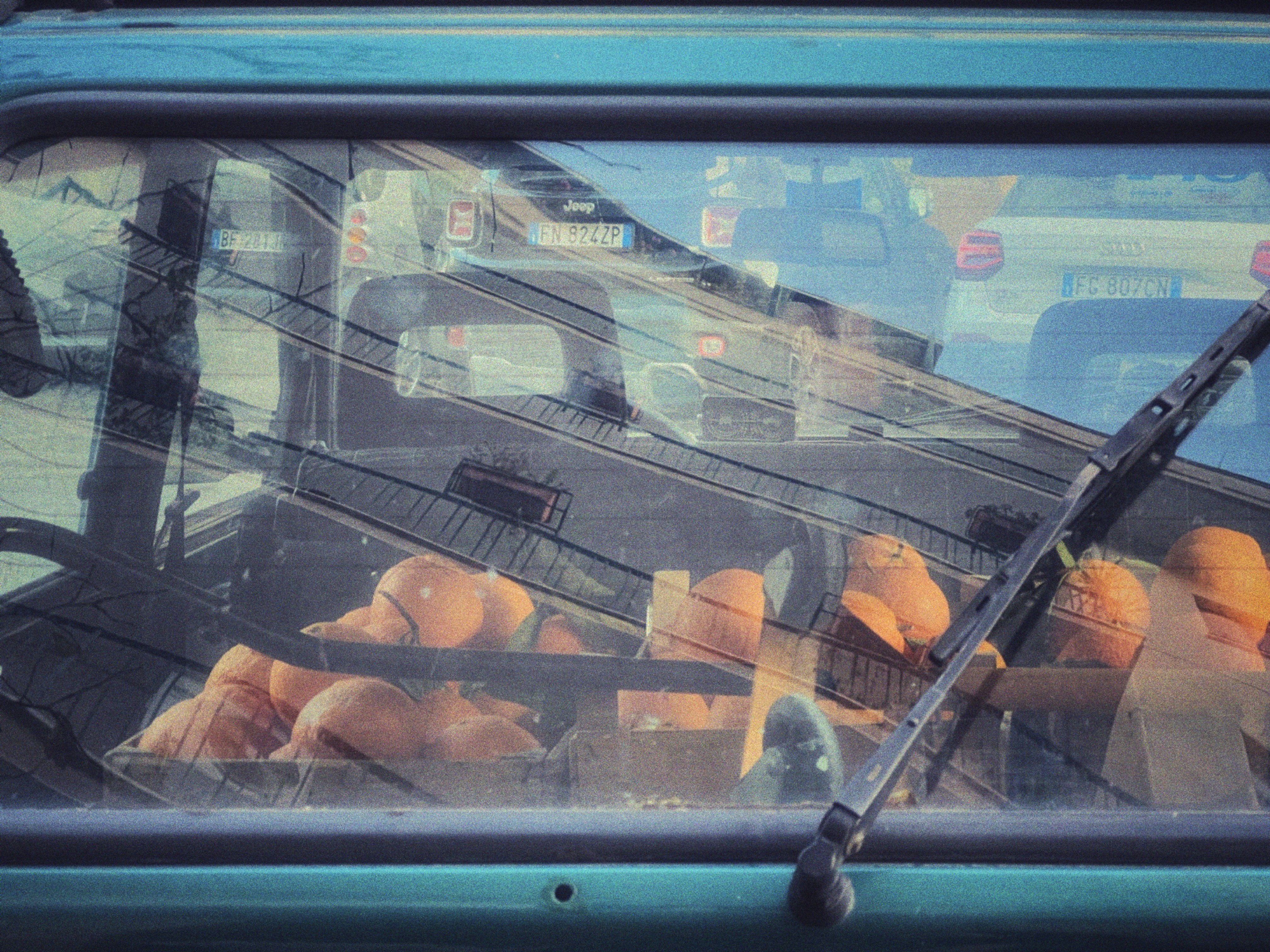 The reflection of a truck in the windshield