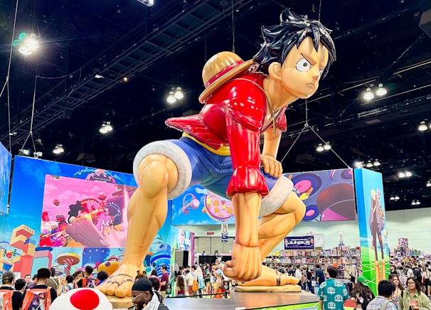 A large statue of a boy kicking a soccer ball