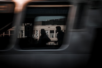 A blurry photo of a train with people on it